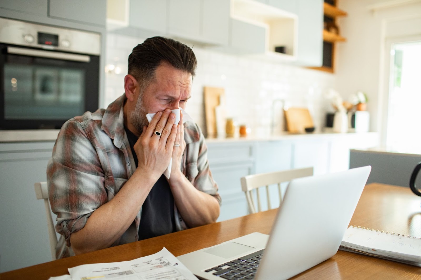 A man blowing his nose