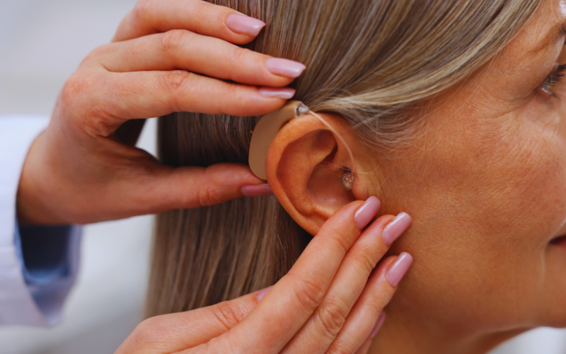 A woman getting a hearing aid
